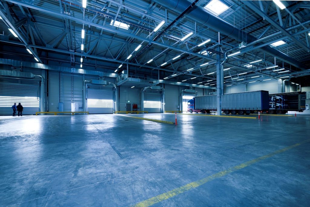 industrial warehouse space with high bay suspended lighting